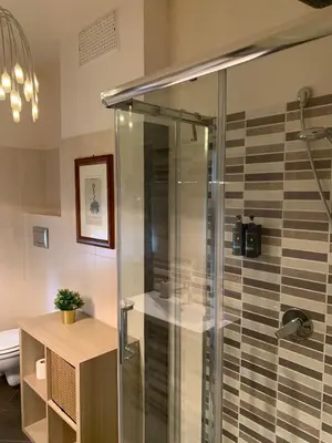 a shower with a glass door in a bathroom at Albachiara Termini in Termini Imerese