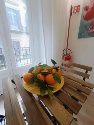 a bedroom with a bed and a chair and a desk at Quattro Canti - residenza Santa Caterina in Palermo