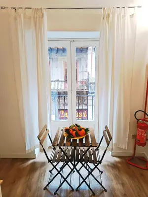 a dining room table with chairs and a plate on the wall at Quattro Canti - residenza Santa Caterina in Palermo
