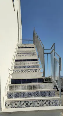a set of stairs with blue and white tiles at Un Posto Al Sole in San Vito lo Capo