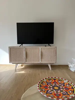 a flat screen tv sitting on top of a entertainment center at Villa Francesca in Carini