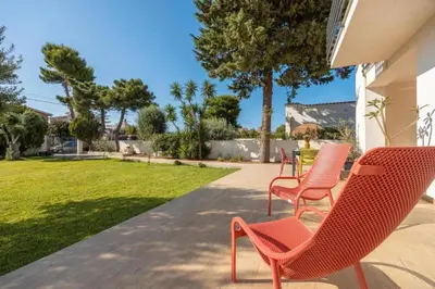 a group of chairs and a table on a patio at Villa Francesca in Carini