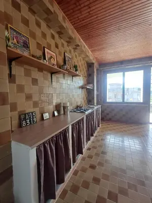 a kitchen with a counter with towels on it at Casa Di Mitri in Carini