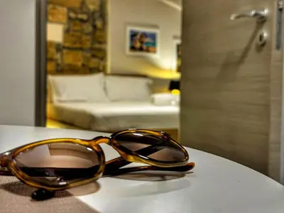 a pair of glasses sitting on top of a table at MaMa7 in Palermo