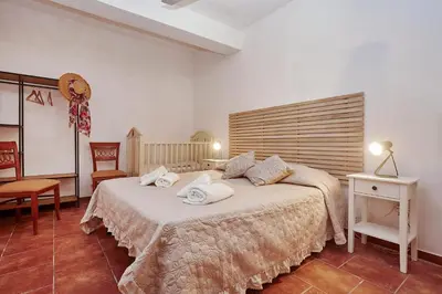 a bedroom with a large bed with towels on it at VILLa CON PISCINA SCOPELLO in Castellammare del Golfo