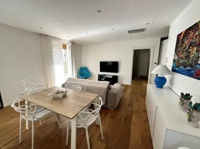 a living room with a table and a couch at Lazio apartment nel centro di Palermo in Palermo