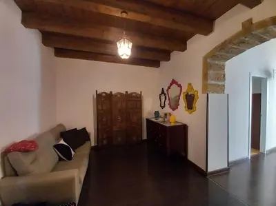a living room with a couch and a table at Casa Bosco a Ballarò in Palermo