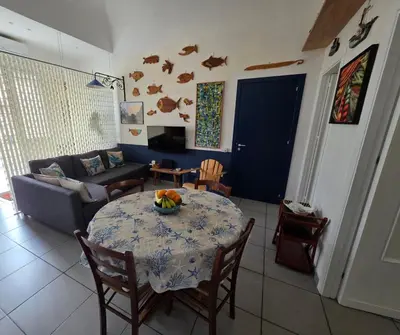 a living room with a table and a couch at 'a casetta - Sferracavallo in Palermo