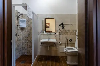 a bathroom with a toilet and a sink at Fattoria F.lli Marsolo in Chiusa Sclafani