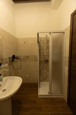 a bathroom with a shower and a sink at Fattoria F.lli Marsolo in Chiusa Sclafani