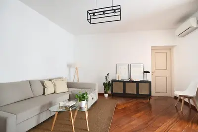 a living room with a couch and a table at iFlat Casa Viscuttara in Palermo