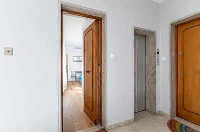 an open door in a room with a hallway at GuestHost - Teatro Massimo Modern Studio in Palermo