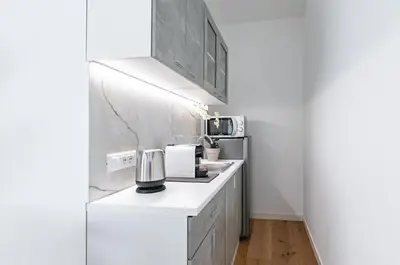 a kitchen with a counter with a coffee maker on it at GuestHost - Teatro Massimo Modern Studio in Palermo