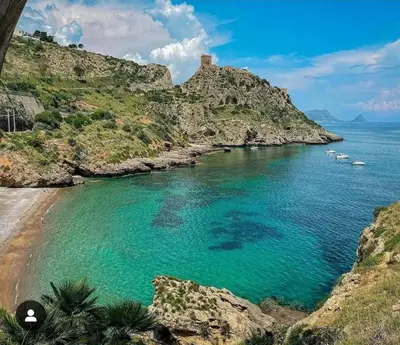a view of a beach with boats in the water at Milicia Apartment in Mandra Capreria