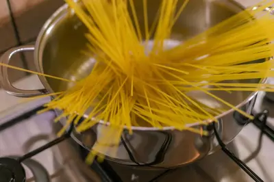 a bunch of pasta in a pot on a stove at Villa Seaside in Campofelice di Roccella