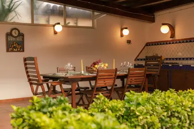 a dining room with a table and chairs at Villa Seaside in Campofelice di Roccella