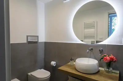 a bathroom with a sink and a mirror at Ermosa Suite in Palermo