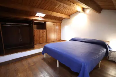 a bedroom with a bed and a flat screen tv at Politeama Holiday Home - La tua casa nel cuore di Palermo! in Palermo