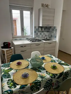 a kitchen with a table with hats on it at Casa Gabriele in Palermo