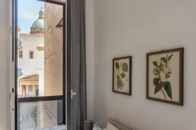 a mirror on a wall next to a window at Casa Brunaccini con Terrazza by Wonderful Italy in Palermo