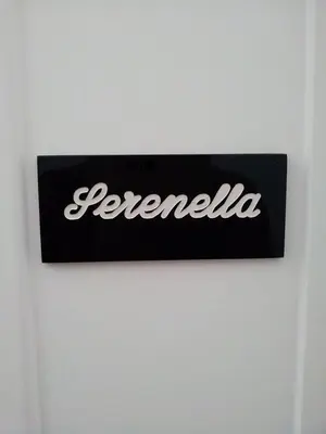a sign on a wall with the word reichenelia at B&B Paolo e Mariella in Palermo