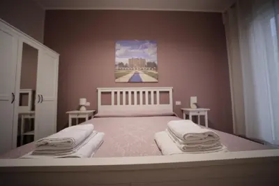 a bedroom with a bed with towels on it at Casa di Paola in Palermo
