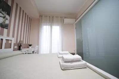 a room with three towels on a bed at Casa di Paola in Palermo