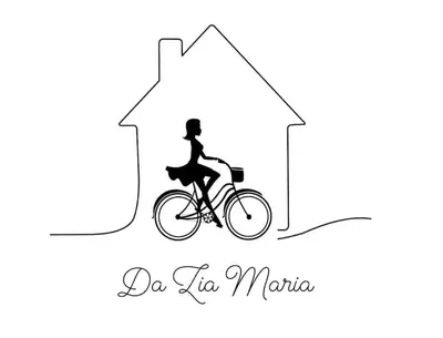 a woman riding a bike in a arrow at Da Zia Maria in Palermo