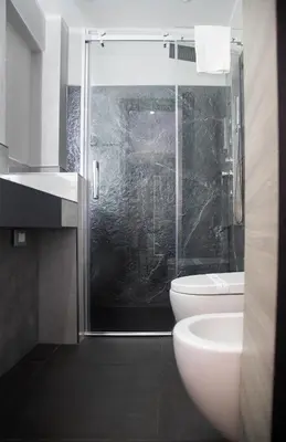 a bathroom with a shower and a toilet and a sink at Residence Villa Rosa dei Venti in Cinisi