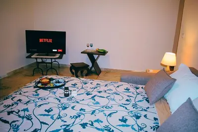 a hotel room with a bed and a tv at La Casa di Gus in Palermo