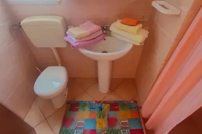 a small bathroom with a toilet and a sink at Casetta vista mare 2 Climatizzata in Castellammare del Golfo