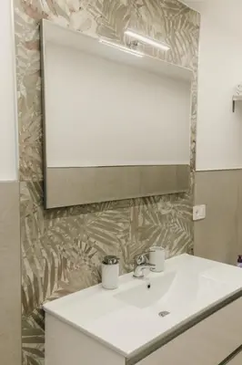 a bathroom with a sink and a mirror at Sofia's Central Apartment Palermo in Palermo