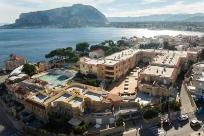 an aerial view of a city and the water at Sikanart Home in Palermo