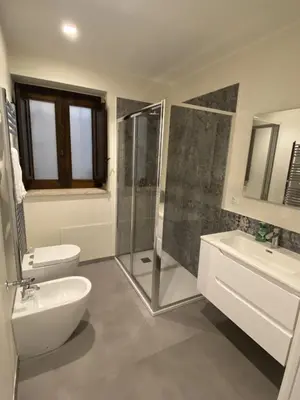 a bathroom with a sink and a toilet and a shower at Casa Penelope in Mondello