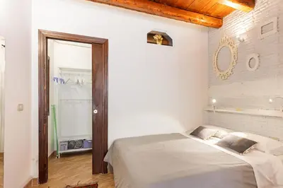 a bedroom with a large bed in a room at GuestHost - GuestHost - Giusino Experience in Palermo's Heart in Palermo