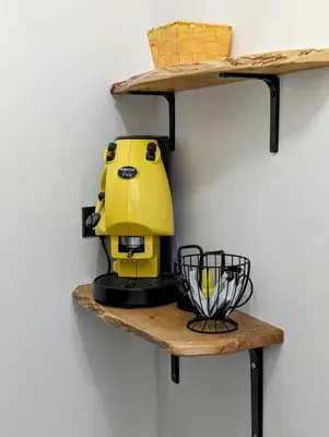 a yellow mixer on a shelf on a wall at I colori della Sicilia in Cinisi