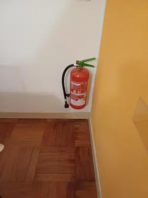 a fire extinguisher sitting on a shelf in a room at Appartamento Alessandro al porto in Palermo