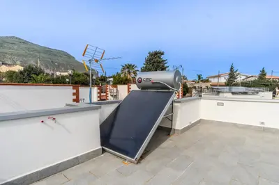 a slide on the roof of a building at NIKA NIKA Holiday House in Carini