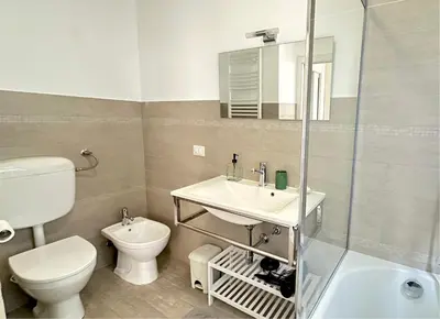 a bathroom with a sink and a toilet and a shower at Residenza Cattedrale in Palermo