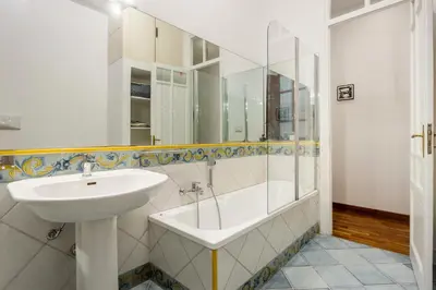 a kitchen with a table and a dining room at Cicco's Home - Holidays Apartment in Palermo