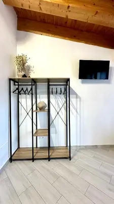 a black console table in a room with a ceiling at 4Rooms in Palermo