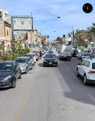 a busy city street filled with lots of cars at 4Rooms in Palermo