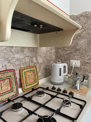 a kitchen with a stove top in a kitchen at La Villetta di Sofia in Carini