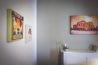 a room with two posters on the wall at Il Bel Canto - Suite in centro storico in Palermo