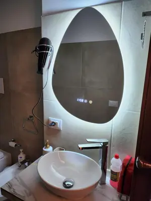 a bathroom with a sink and a large mirror at Maison M&M in Palermo
