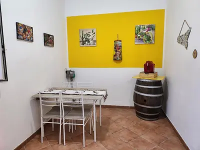 a tasting room with a table and a barrel at Maison M&M in Palermo