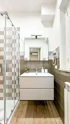 a bathroom with a white sink and a shower at ARIA b&b in Terrasini