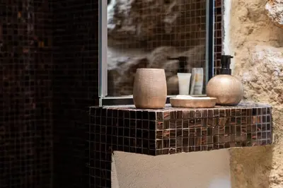 a window sill with vases and other items on it at SantaTeresa19 Suite & Spa in Palermo