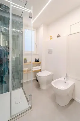 a bathroom with a shower and a toilet and a sink at Trabia25 Suite Palermo in Palermo