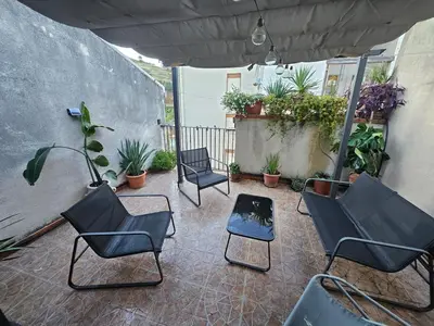 a patio with four chairs and a table anditures at casa Ennio by Villa Paola Ciminna in Ciminna